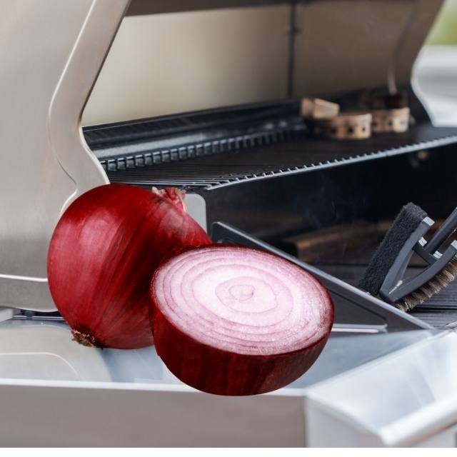 photo of grill with red onion on ledge